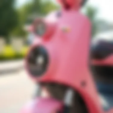 Close-up of the design features of a pink electric scooter